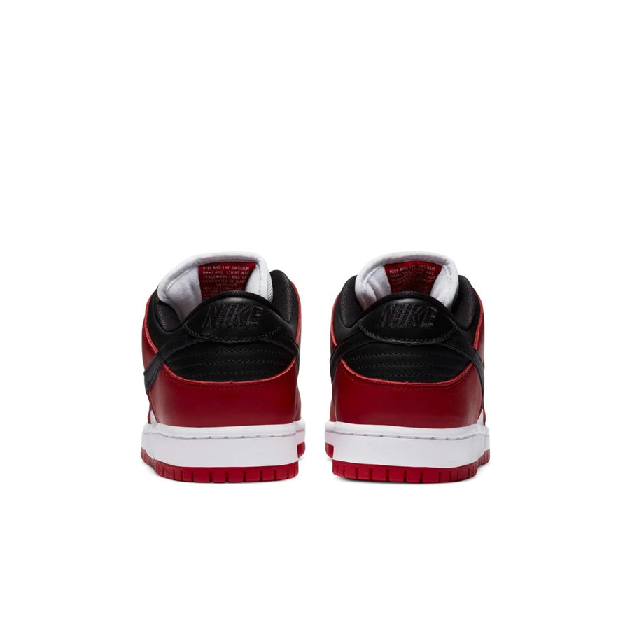 Nike SB Dunk Low J-Pack Chicago pair rear view showing black heel panel with embossed Nike branding and red outsole